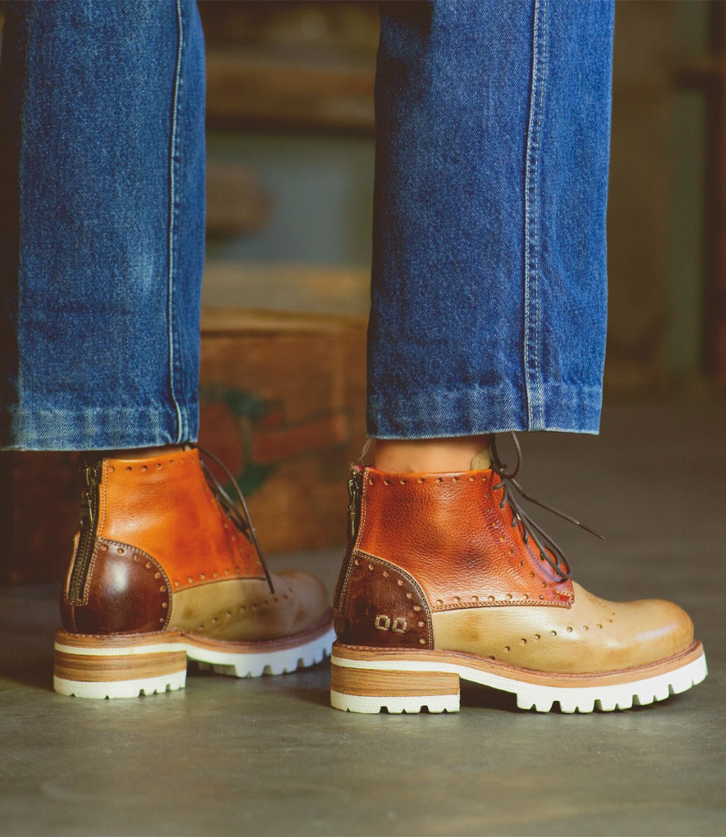 A pair of Bed Stu Quatro III boots on a person's feet.