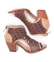 Experience the exquisite craftsmanship of the Ransom sandals by Bed Stu, featuring a pair of brown leather woven design, a chunky wooden heel, and a convenient zipper closure at the back.