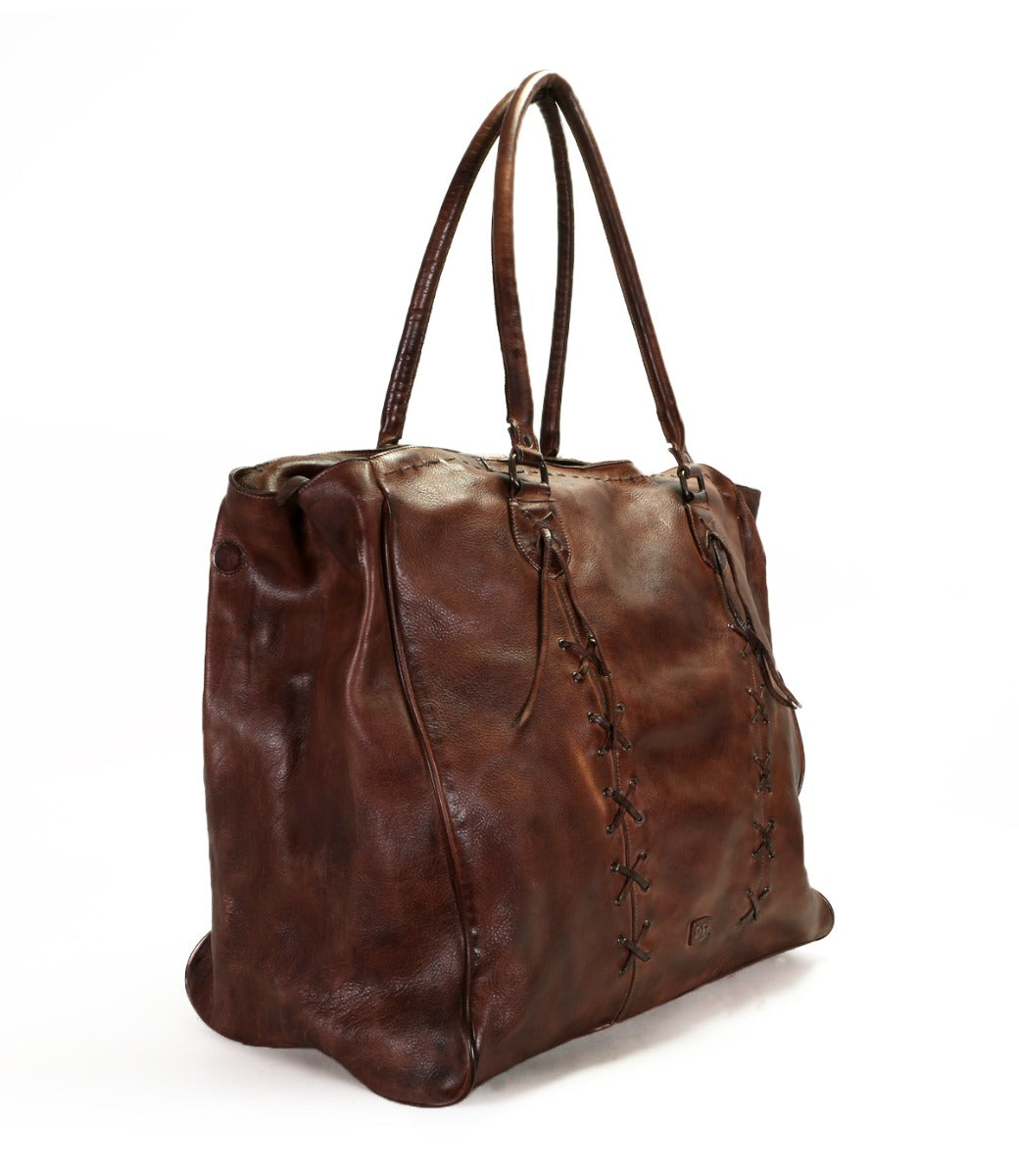 A Rebekah handbag by Bed Stu, made of leather with a strap.