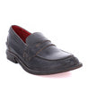 A women's black Reina loafer with a red sole by Bed Stu.