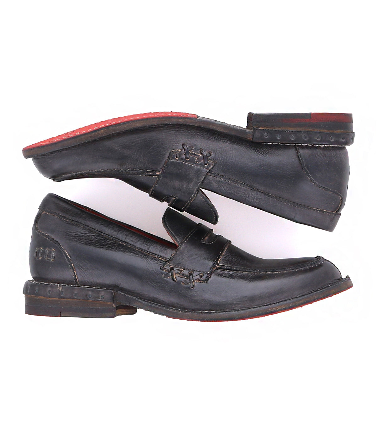 A pair of Reina loafers by Bed Stu with red soles.