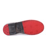 A pair of Reina shoes with red and black soles by Bed Stu.