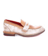 A Reina women's loafer in beige with a red sole by Bed Stu.