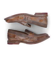 A pair of Bed Stu Reina brown loafers on a white background.