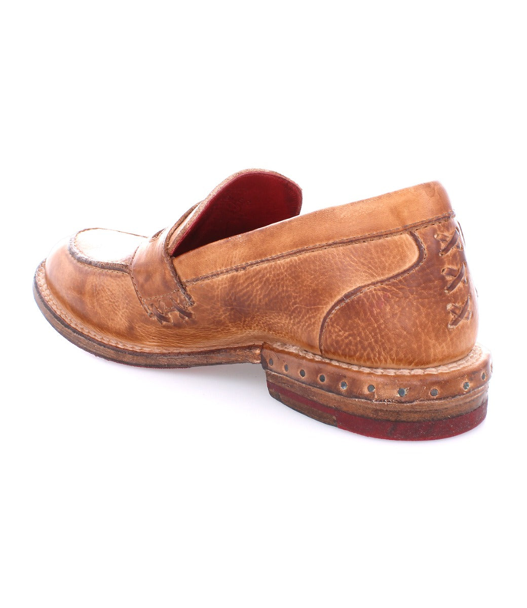 A women's brown loafer with studded soles called Reina by Bed Stu.