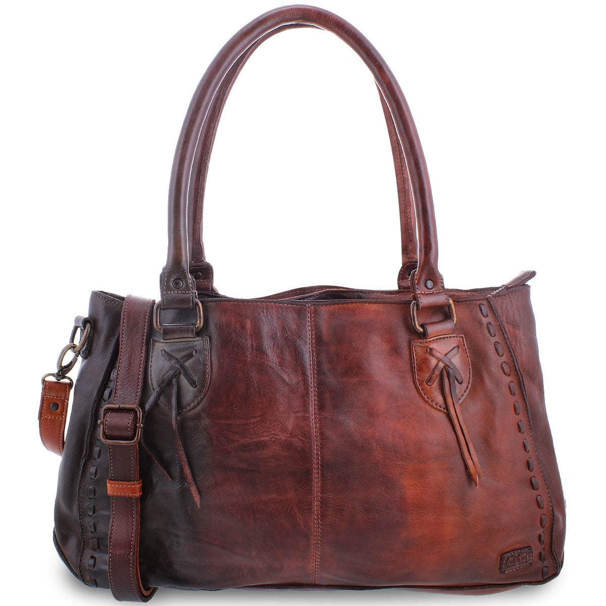 The Rockababy by Bed Stu is a leather handbag featuring comfortable padded shoulder straps, a front pocket tied with leather strings, and a detachable, adjustable strap. The bag showcases stitch detailing along the edges and includes a small leather tag.
