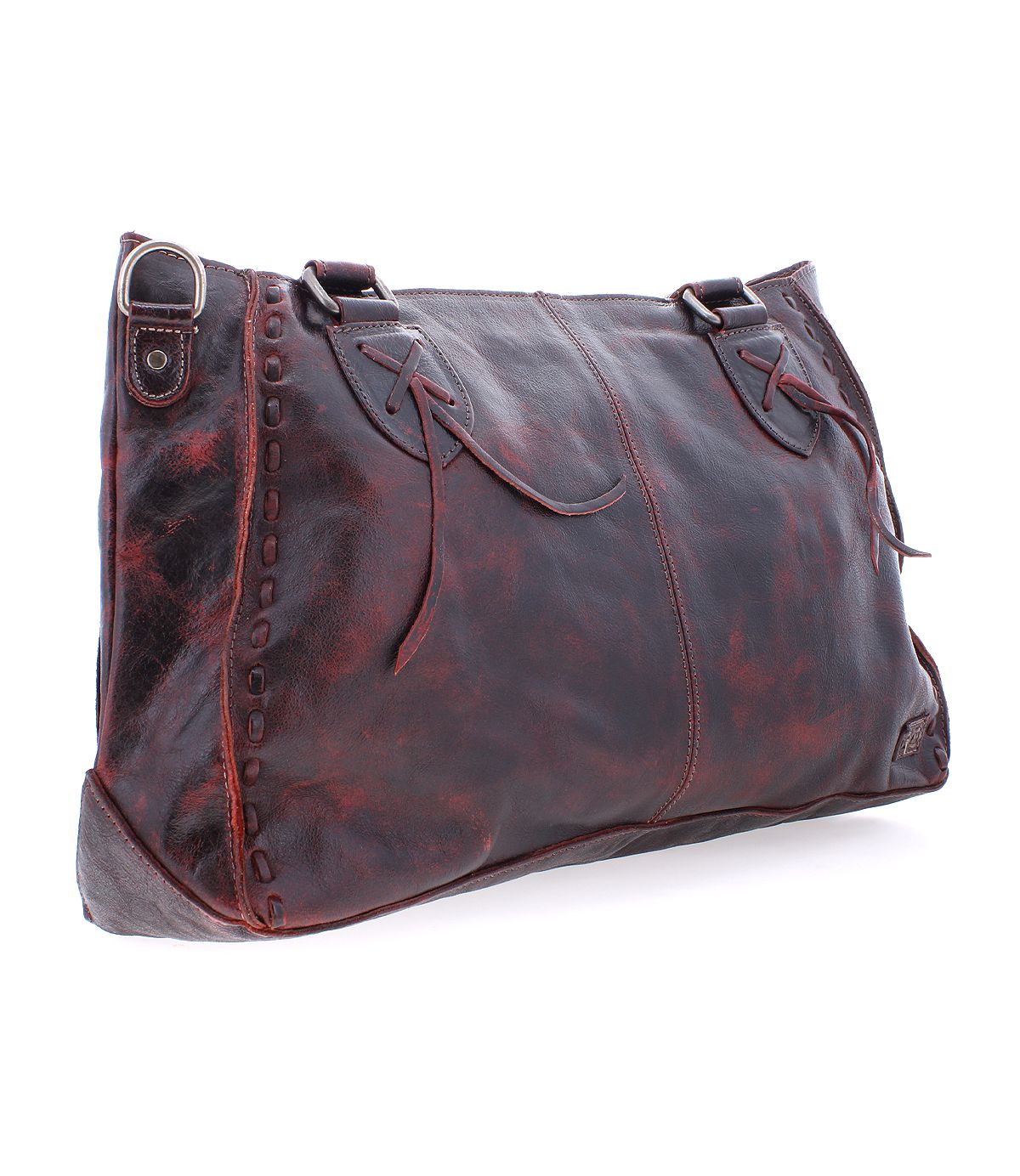 The Rockababy by Bed Stu is a stylish everyday bag perfect for any occasion, featuring decorative stitching, two handles, and a metal ring detail on the top left corner, all crafted from brown leather.