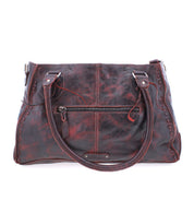 Introducing the Rockababy by Bed Stu, a dark brown leather handbag featuring a front zipper pocket and two shoulder straps. This compact bag is the perfect stylish everyday accessory.