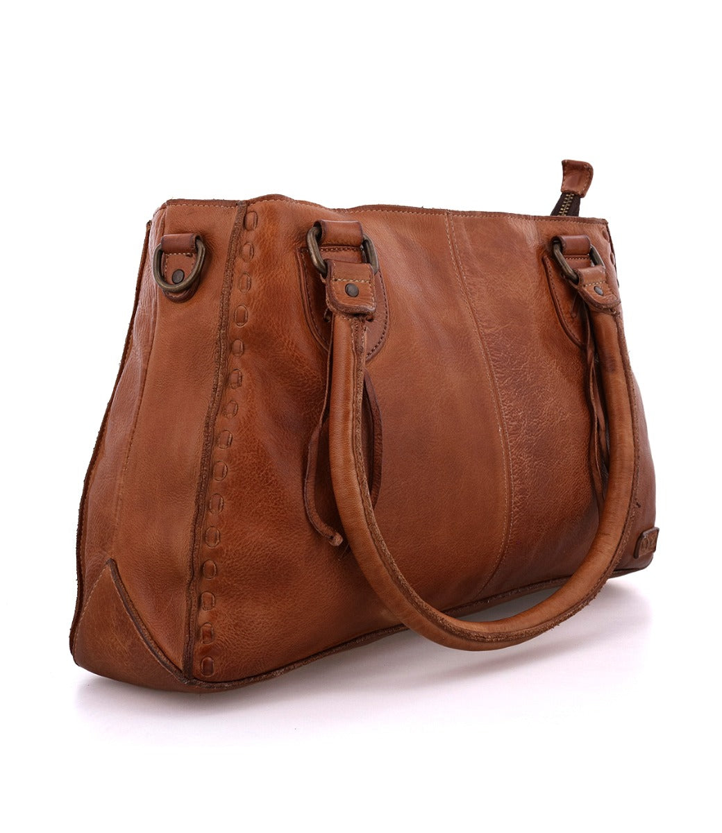 A Rockababy tan leather handbag with a handle.