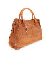 The Rockaway by Bed Stu is a fan favorite and it’s no wonder why—this best-selling large brown leather handbag features two round handles, stitched detailing along the sides, and a zip-pocket divider.
