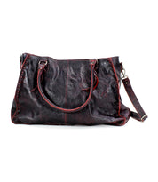 The Rockaway handbag by Bed Stu is a large, dark brown leather accessory with red stitching, featuring two handles and an adjustable shoulder strap that epitomizes functionality.