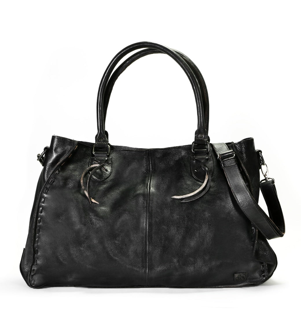 A Rockaway handbag by Bed Stu with metal handles.