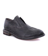 A men's black leather slip on Bed Stu Rose shoe.