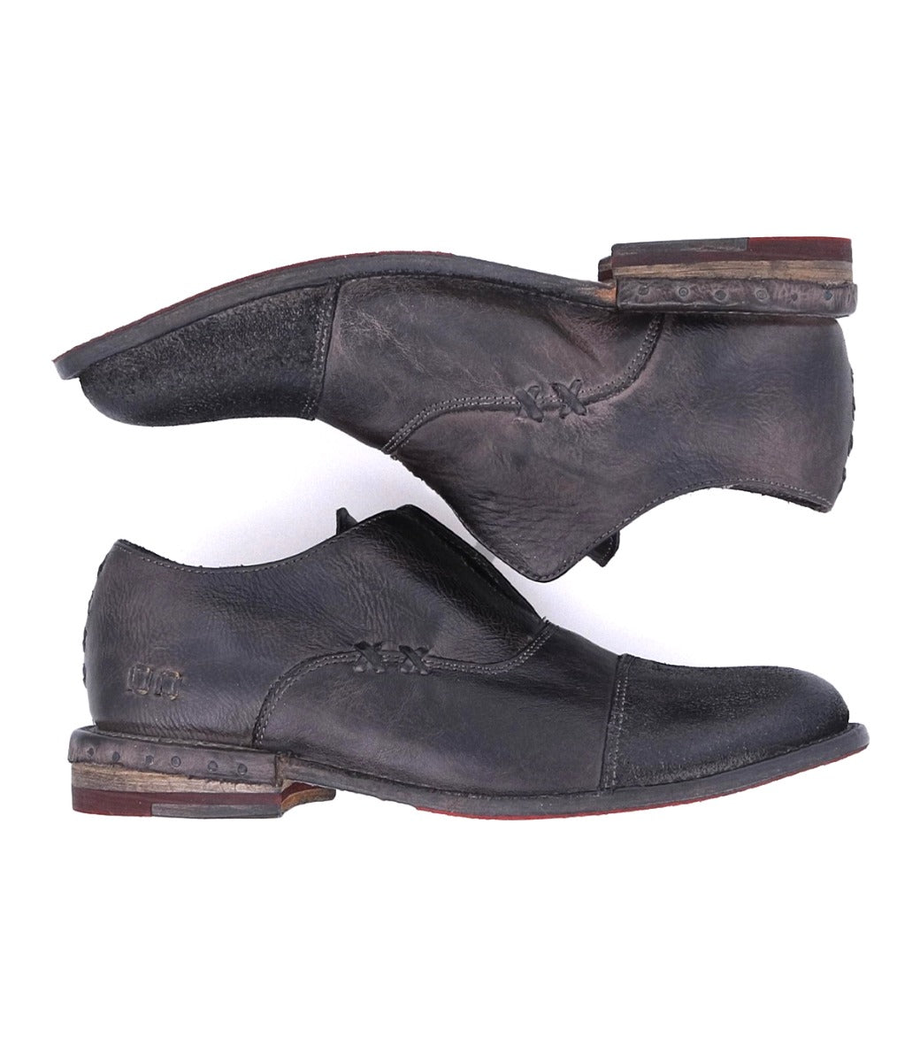 A pair of Bed Stu Rose men's black leather shoes on a white background.