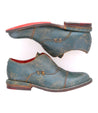 A pair of Rose blue leather shoes with red soles by Bed Stu.