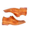 A pair of men's Rose shoes with Bed Stu tan soles.