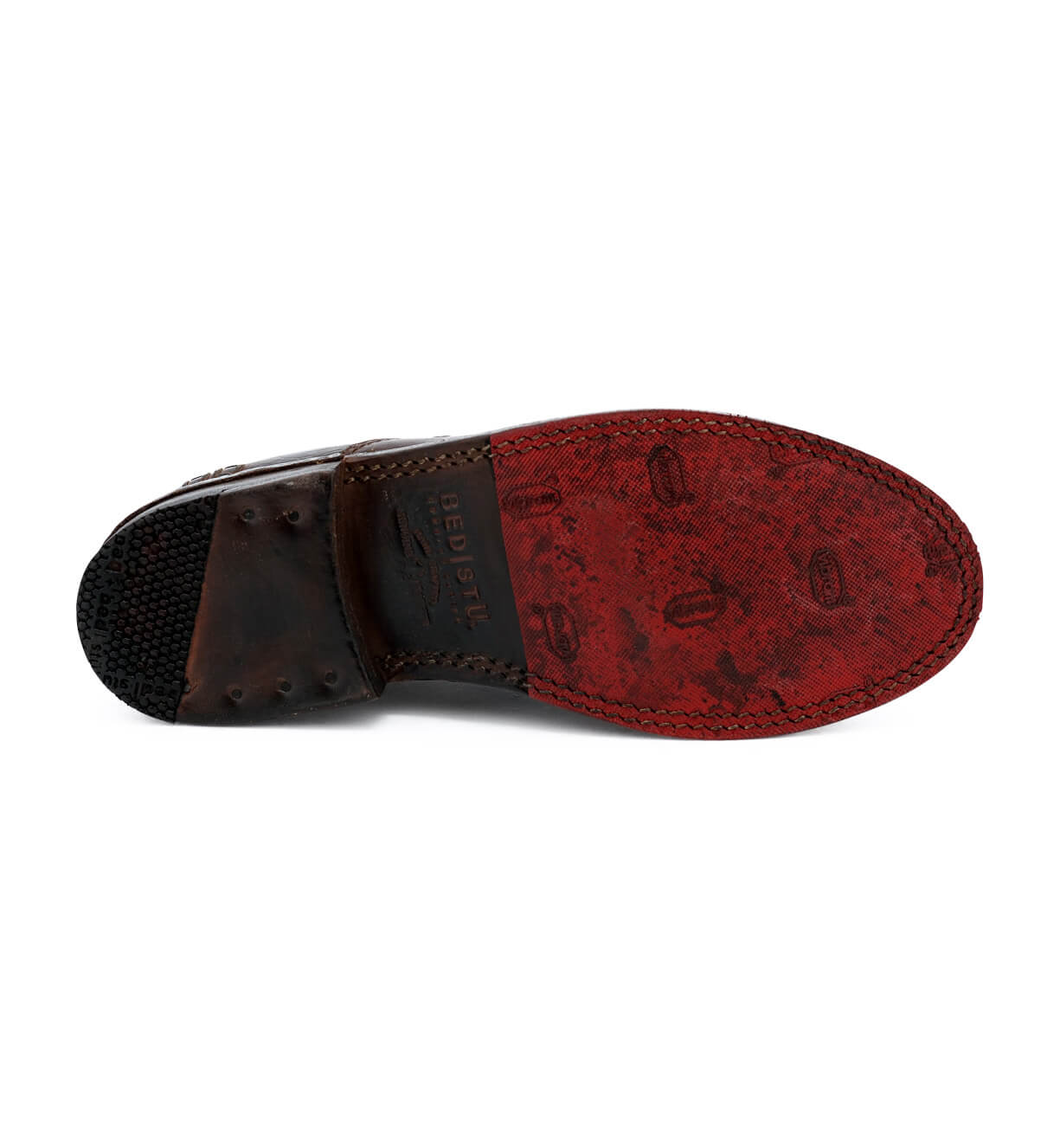 A pair of Bed Stu men's shoes with a red sole.