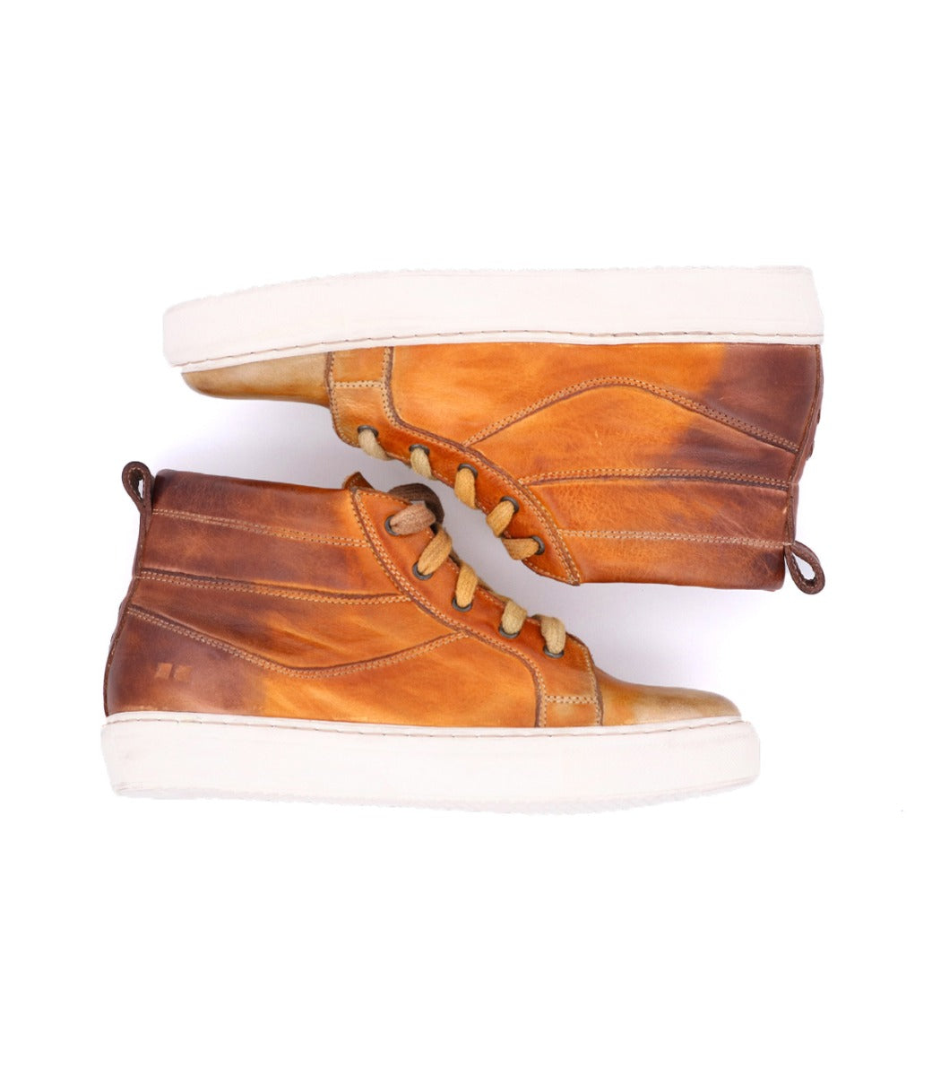 A pair of Bed Stu Rossela brown leather sneakers on a white background.