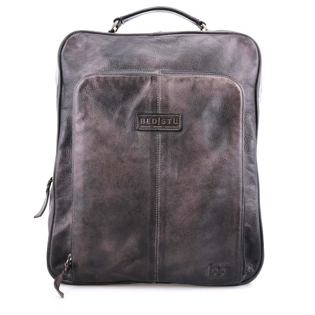 A grey leather Rozes backpack with a zipper, from Bed Stu.