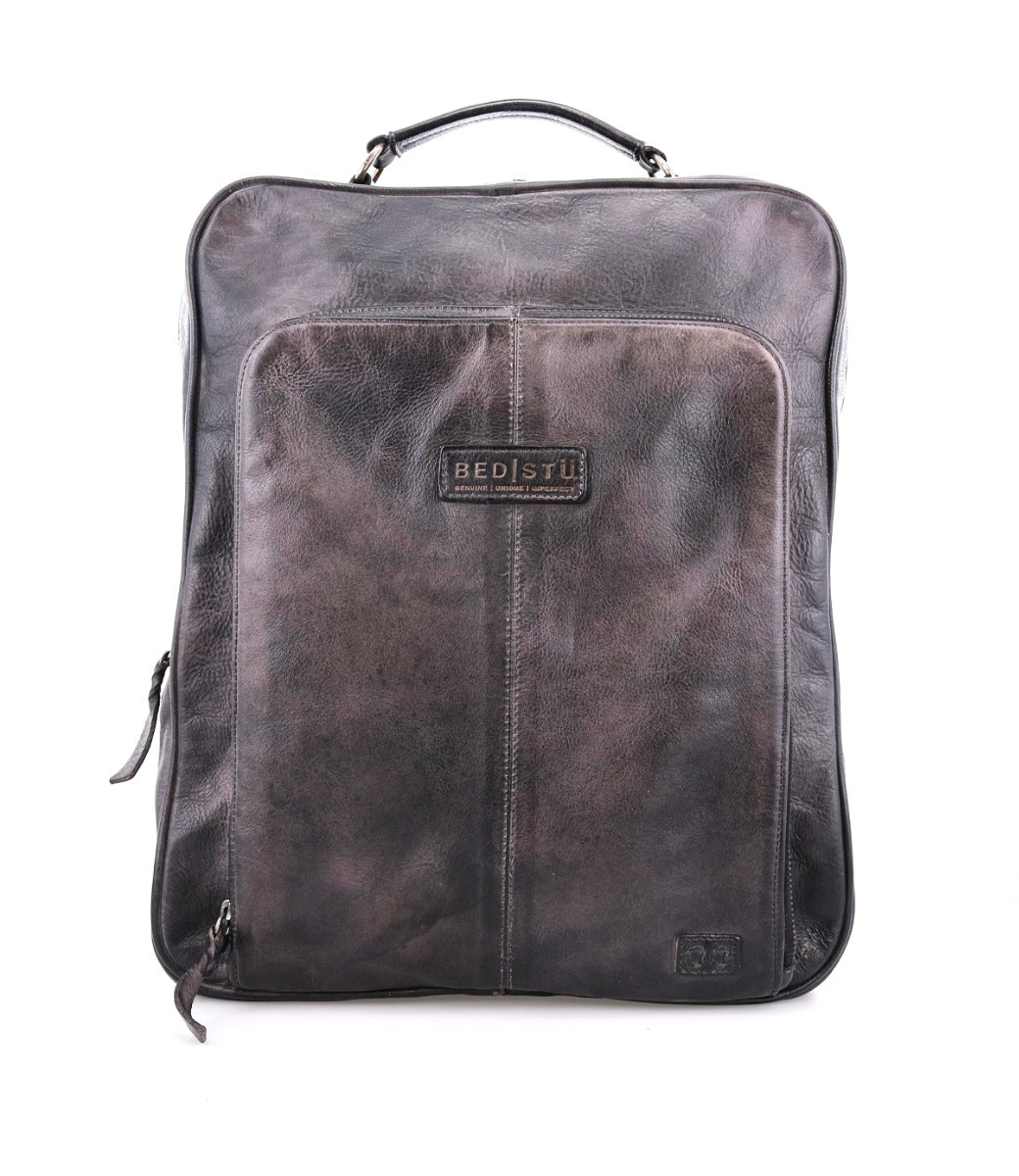 A grey leather Rozes backpack with a zipper, from Bed Stu.