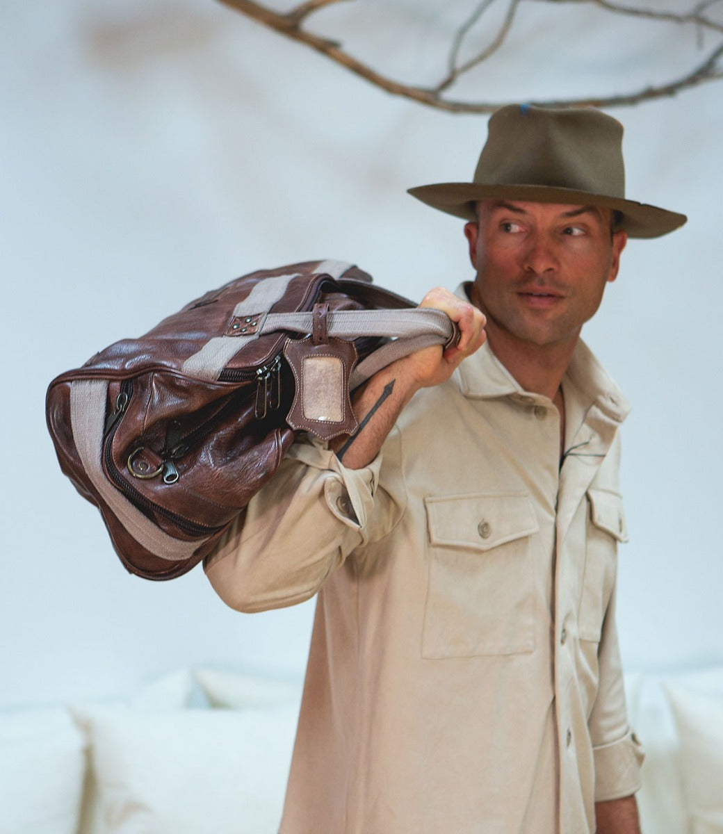 A man holding a Ruslan bag by Bed Stu.