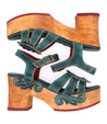A pair of green wooden Sabine sandals with a Bed Stu wooden heel.