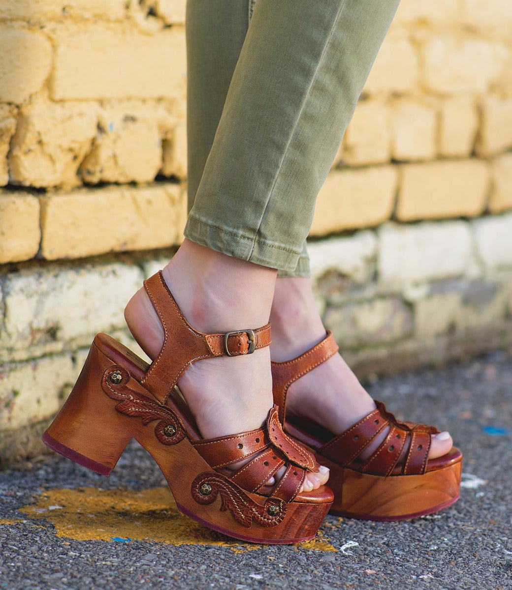 A woman wearing a pair of Sabine platform sandals by Bed Stu.