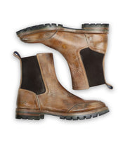 The Salatiel boots by Bed Stu are crafted using brown leather and feature black elastic side panels, a sturdy leather footbed, and rugged rubber soles.