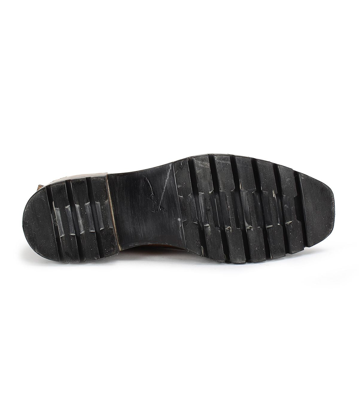 Close-up of the sole of a black Salatiel Men's Chelsea boot by Bed Stu, featuring deep tread patterns. The slightly worn appearance hints at the unmatched comfort offered by this footwear.