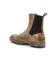 Introducing the Salatiel by Bed Stu: a brown leather Chelsea boot with a stylish black elastic side panel and a durable textured sole.