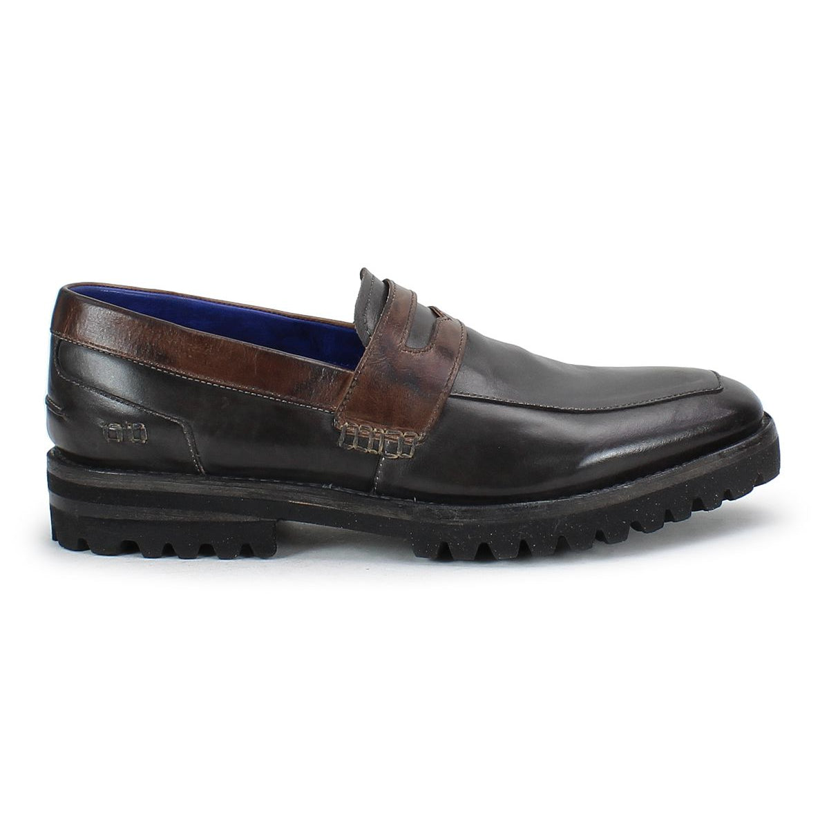Introducing the Bed Stu Samosa: a men's penny loafer crafted from dark brown leather, showcasing a moc toe design and a chunky black sole, offering timeless appeal and refined charm.