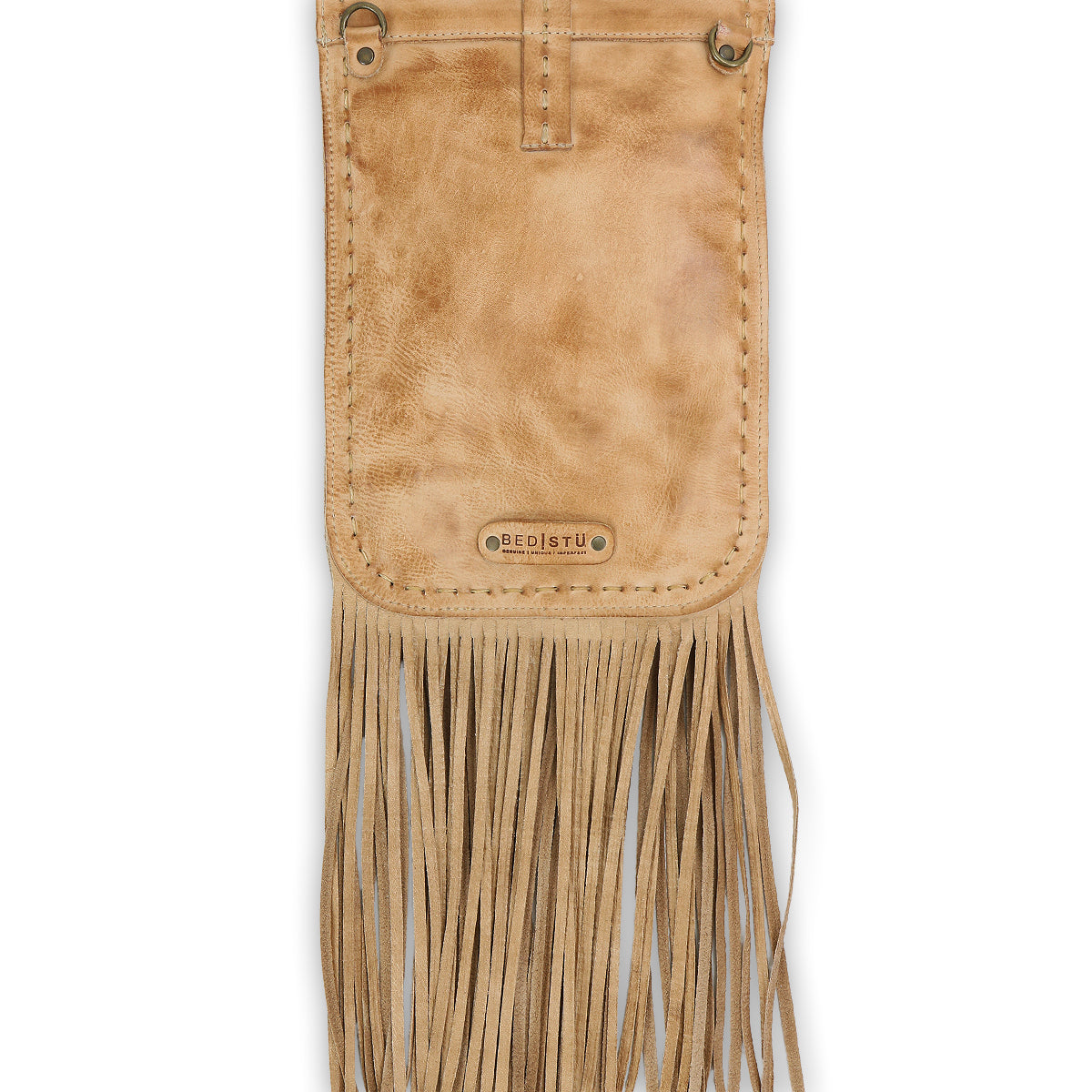 The Sandy Lane II by Bed Stu is a handmade tan leather bag with a stitched border, metallic grommets at the top corners, a metal logo plate, and long fringe along the bottom edge.