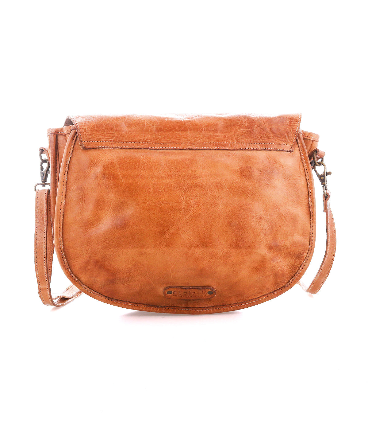 The Bed Stu Sequoia EM is a tan vegetable-tanned leather crossbody saddle bag featuring a flap closure, visible stitching, and an adjustable shoulder strap, shown against a white background.