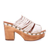 A Shantel women's white platform sandal with wooden heels by Bed Stu.