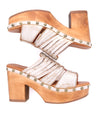 A pair of white Shantel sandals with studded heels from Bed Stu.