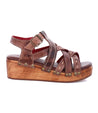 A women's brown sandal with straps and wooden platform, called the Shirley by Bed Stu.