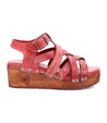 A women's Shirley red sandal with straps and wooden platform by Bed Stu.