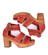 A pair of Sloane sandals with wooden heels by Bed Stu.