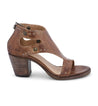 A women's Sona sandal by Bed Stu, made of brown leather with studs and a wooden heel.