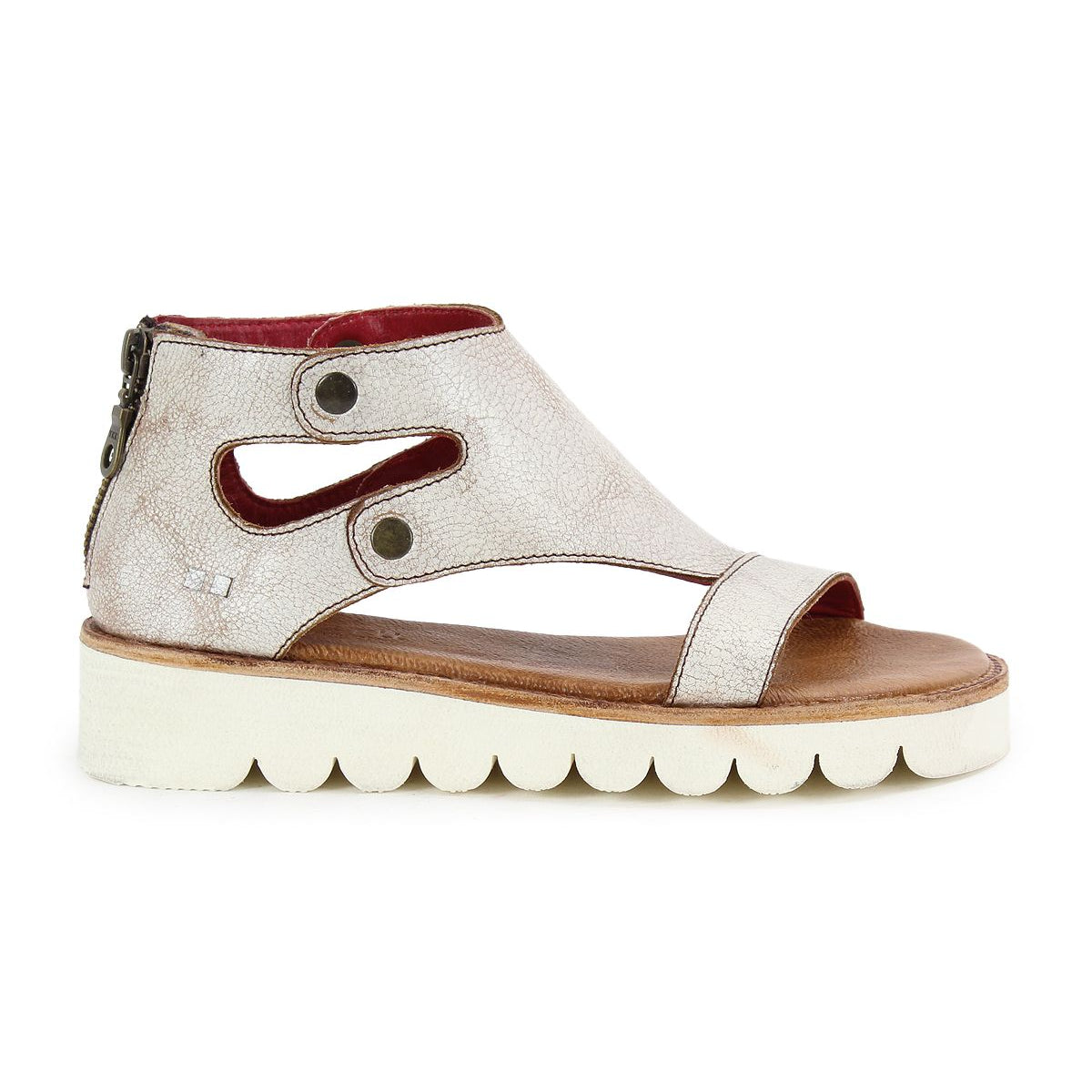 The Bed Stu Soni II is a silver platform sandal featuring a cut-out design, white scalloped XL EXTRALIGHT® outsole for comfort and style, and a back zipper closure.