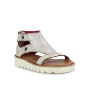 The Soni II by Bed Stu is a silver platform sandal with an ankle strap, side cutouts, and zip closure. It features a white wavy XL EXTRALIGHT® outsole and a brown footbed for comfort and style.