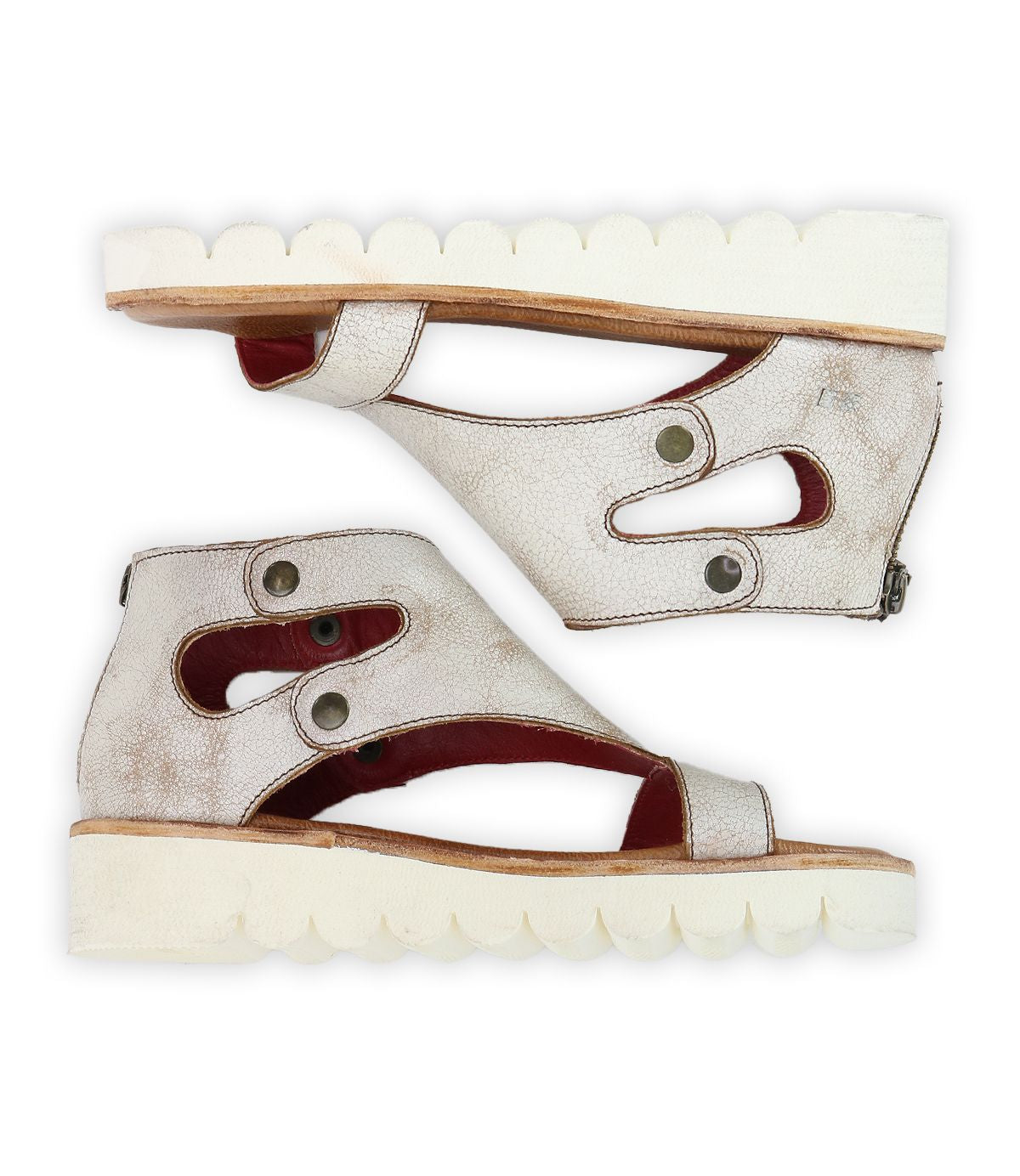 The Bed Stu Soni II are white platform sandals with cutout designs and side buttons, featuring thick, ridged XL EXTRALIGHT® outsoles for enhanced comfort and style, shown from a side view.