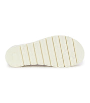 The image highlights the Bed Stu Soni II shoe's white, textured rubber sole with six horizontal grooves, combining comfort and style.