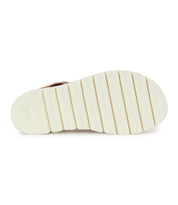 The image shows the sole of the Bed Stu Soni II platform sandal, featuring a white color with parallel grooves, crafted with an XL EXTRALIGHT® outsole for added comfort and style.