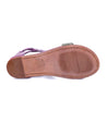 The back view of a women's Bed Stu purple sandal.