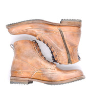 A pair of worn brown leather lace-up ankle boots with side zippers and well-treaded soles, arranged in a crossover layout on a white background by Bed Stu's Spiker boots.