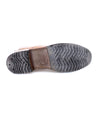 A pair of Bed Stu Spiker brown leather shoes on a white background.