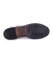 Sole of a Bed Stu brown leather lace-up ankle boot with black tread and embossed text, displayed against a white background.
