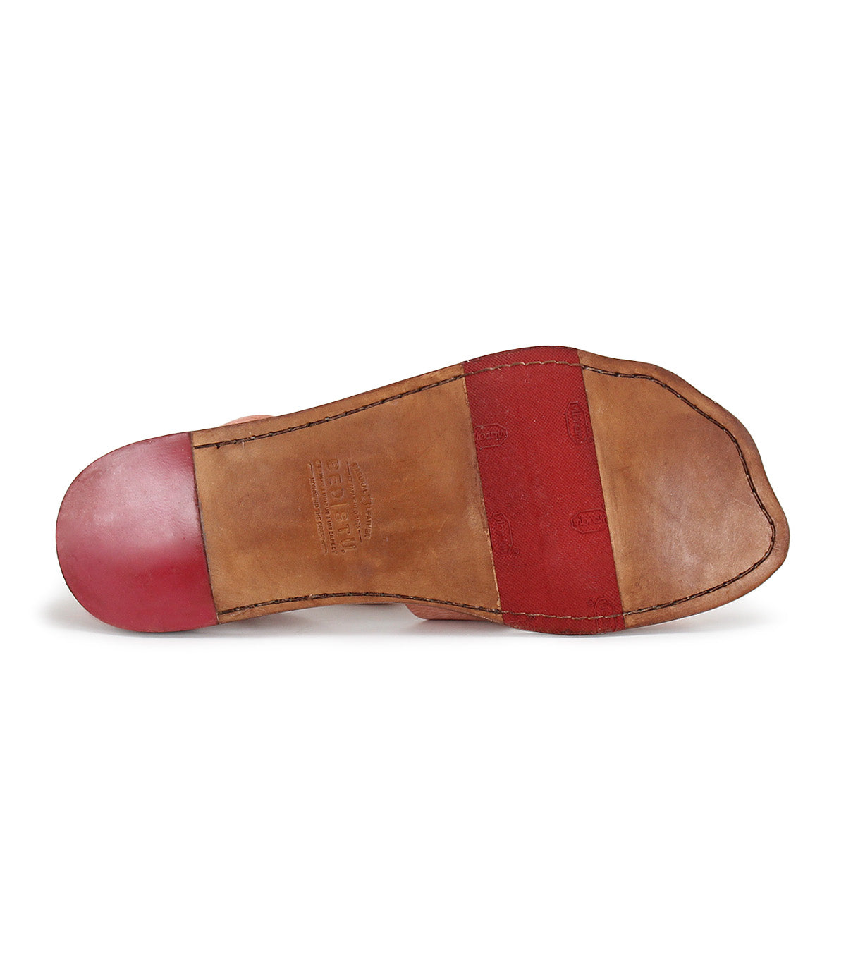 A pair of Bed Stu shoes with red and tan soles.