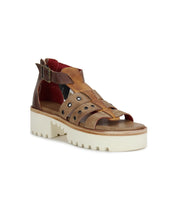 A Pacifica sandal with straps and a white sole by Bed Stu.